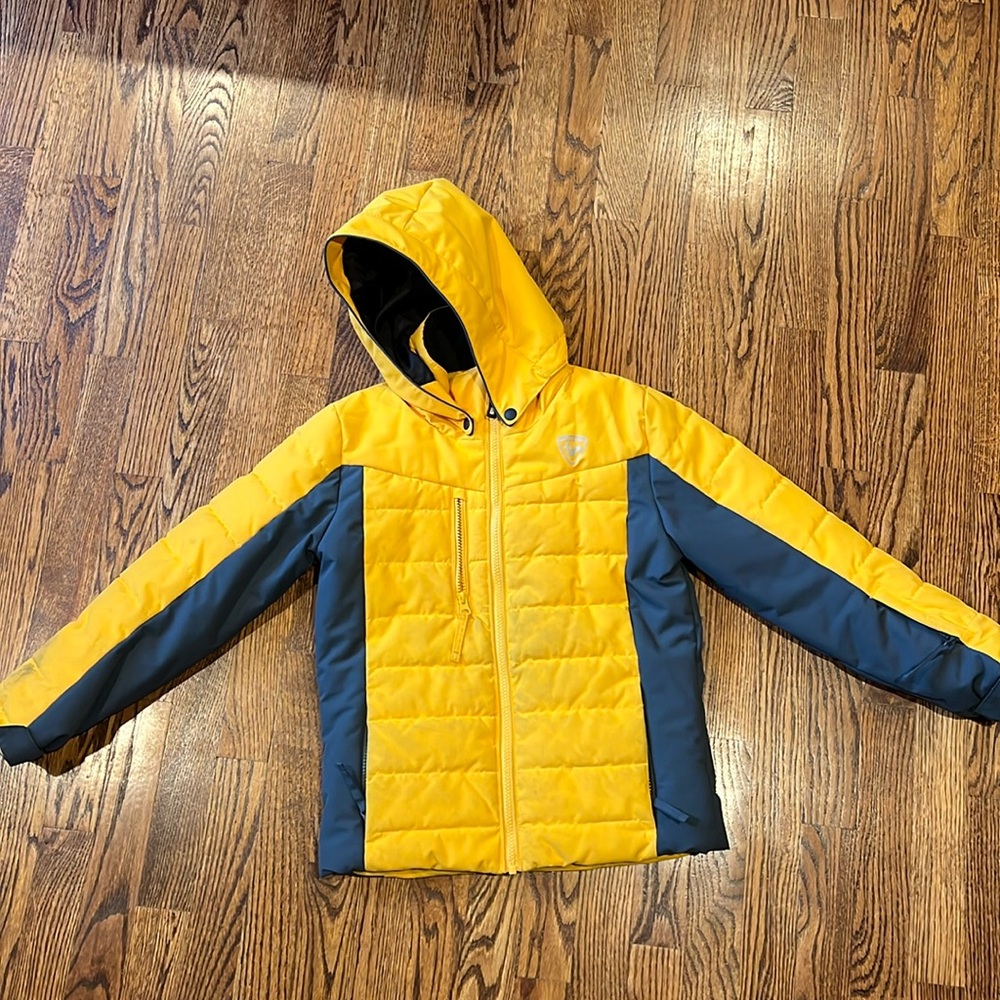 Rossignol boys' ski jacket in yellow, size 10.